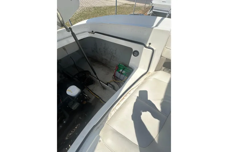 Slide: The Image of 2006 Cobalt 220S boat interior showing engine compartment and battery setup. - 26