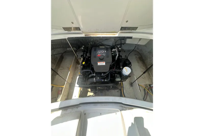 Slide: The Image of Engine compartment of a 2006 Cobalt 220S boat, featuring a MerCruiser 350 MAG MPI engine. - 28