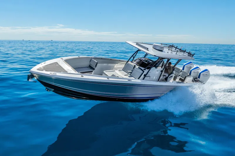 Slide: The Image of 2026 Nor-Tech 390 Sport Center Console cruising on open blue water. - 22