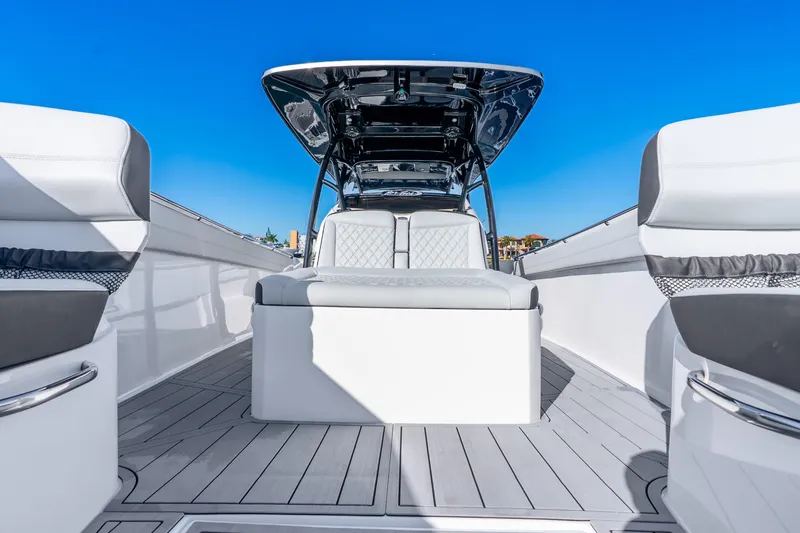Slide: The Image of 2026 Nor-Tech 390 Sport Center Console boat interior with sleek seating and modern design. - 27