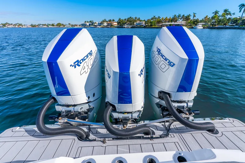 Slide: The Image of Triple outboard engines on a 2026 Nor-Tech 390 Sport Center Console boat. - 31