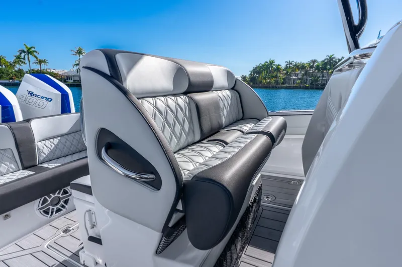 Slide: The Image of 2026 Nor-Tech 390 Sport Center Console with luxurious seating and scenic waterfront view. - 35