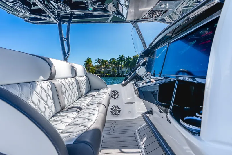 Slide: The Image of Luxurious interior of 2026 Nor-Tech 390 Sport Center Console boat with plush seating and sleek dashboard. - 40