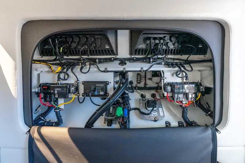 Slide: The Image of Electrical panel of 2026 Nor-Tech 390 Sport Center Console boat, showcasing wiring and components. - 45
