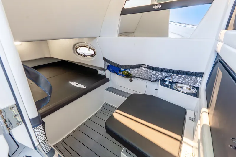 Slide: The Image of 2026 Nor-Tech 390 Sport Center Console cabin interior with seating and storage. - 47