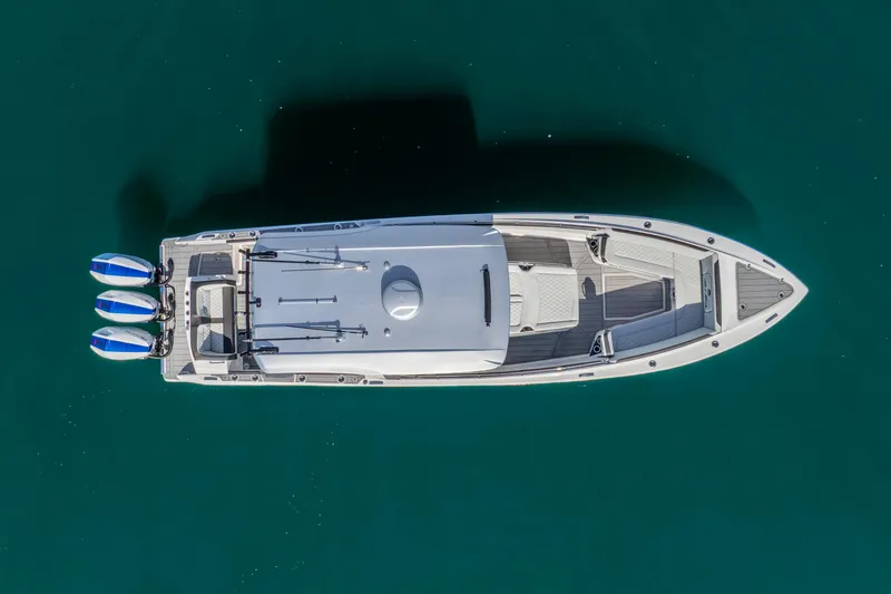 Slide: The Image of Aerial view of 2026 Nor-Tech 390 Sport Center Console boat on clear water. - 6
