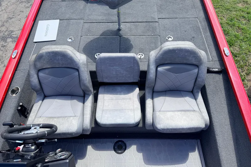 Slide: The Image of 2023 Avid 20 XB boat interior with three gray seats and red trim. - 15