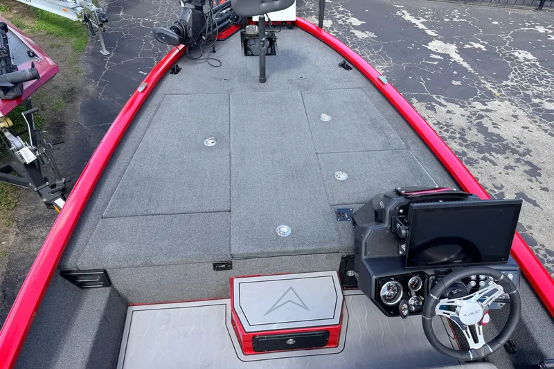 Slide: The Image of 2023 Avid 20 XB boat interior with steering console and seating area. - 16
