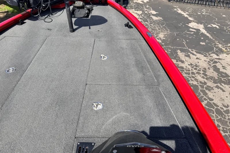 Slide: The Image of 2023 Avid 20 XB boat deck with red trim and gray carpet. - 21