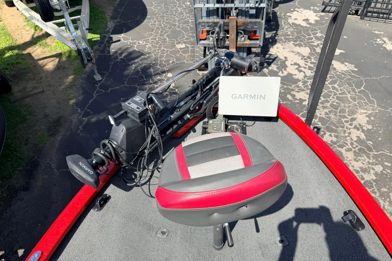 Slide: The Image of 2023 Avid 20 XB boat with Garmin equipment and red-accented seat on deck. - 25