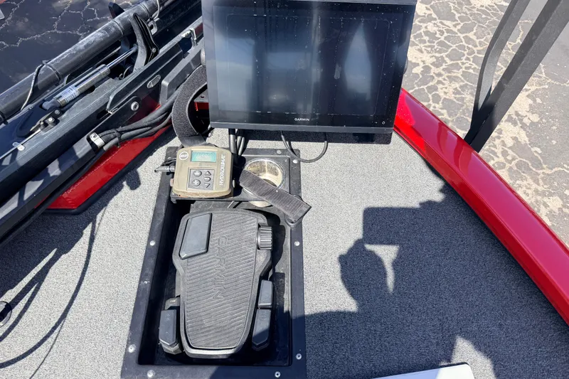 Slide: The Image of Control panel of 2023 Avid 20 XB boat with Garmin display and foot pedal. - 26