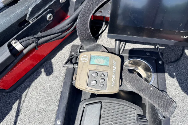 Slide: The Image of Control panel of a 2023 Avid 20 XB boat featuring a HydroWave device. - 28