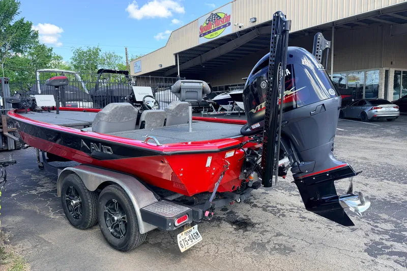 Slide: The Image of 2023 Avid 20 XB boat with Yamaha motor, parked outside dealership. - 3