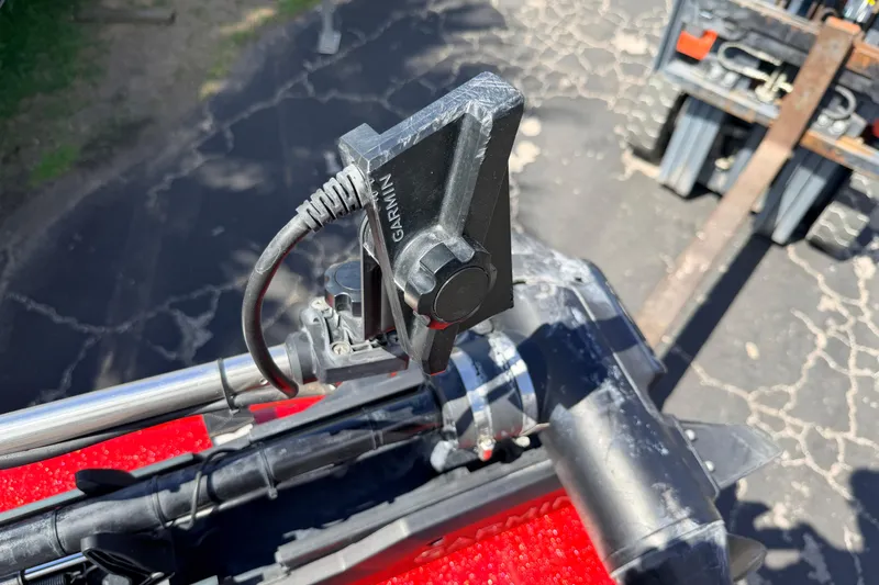 Slide: The Image of Garmin device mounted on 2023 Avid 20 XB boat, outdoor setting. - 30