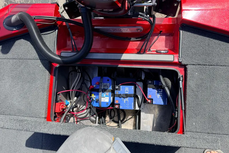 Slide: The Image of 2023 Avid 20 XB boat battery compartment with wiring and components. - 38