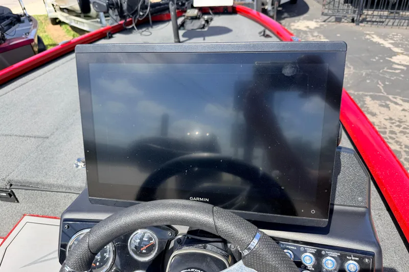 Slide: The Image of Dashboard of 2023 Avid 20 XB boat with Garmin display and steering wheel. - 8