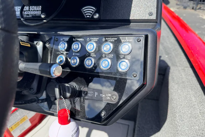 Slide: The Image of Control panel of 2023 Avid 20 XB boat with various switches and indicators. - 9
