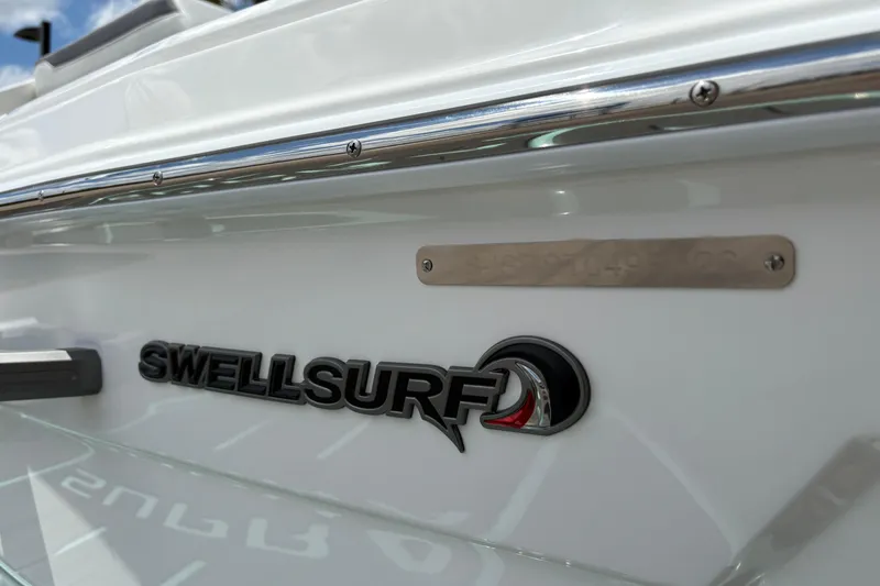 Slide: The Image of 2026 Supra SE 550 boat featuring SwellSurf logo on sleek white exterior. - 13