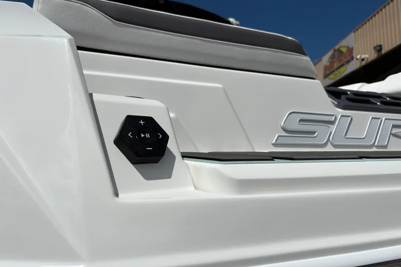 Slide: The Image of 2026 Supra SE 550 boat with control panel and logo detail. - 15