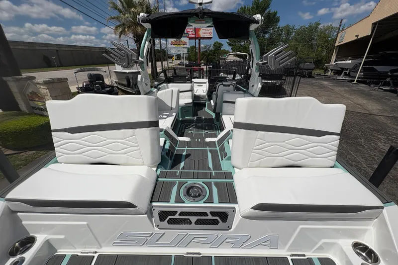 Slide: The Image of 2026 Supra SE 550 boat interior with white seating and modern design. - 17