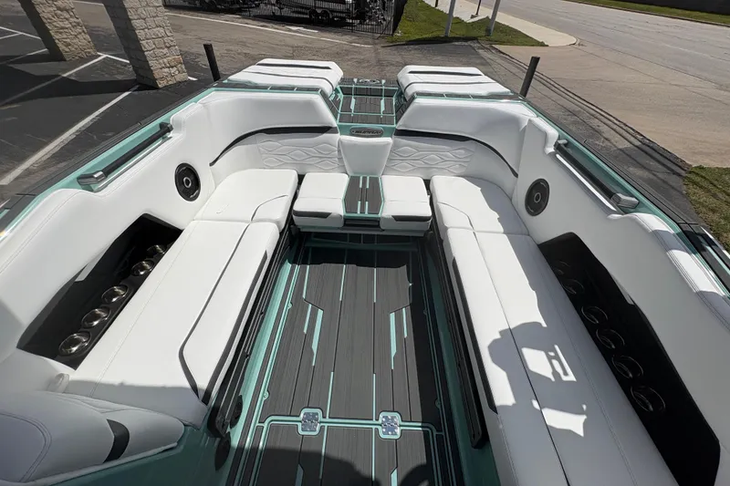 Slide: The Image of 2026 Supra SE 550 boat interior with white seating and modern design. - 21