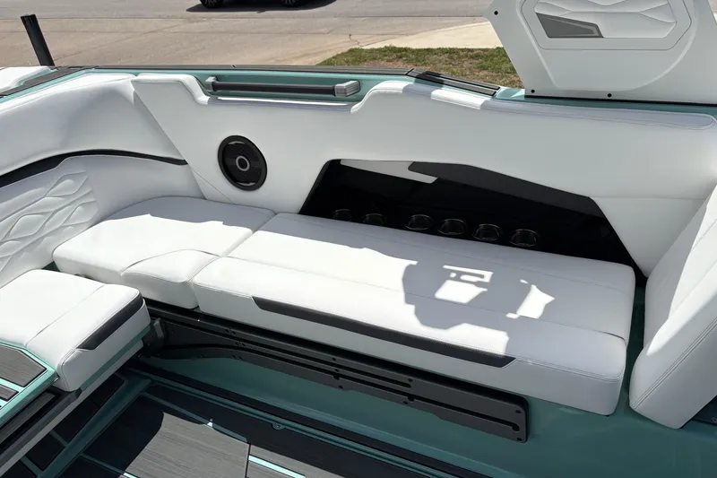 Slide: The Image of Luxurious interior of 2026 Supra SE 550 boat with white seating and speaker system. - 24
