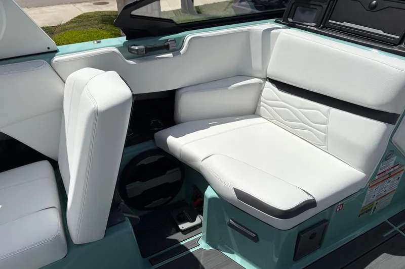 Slide: The Image of Interior seating of 2026 Supra SE 550 boat with white upholstery and modern design. - 25