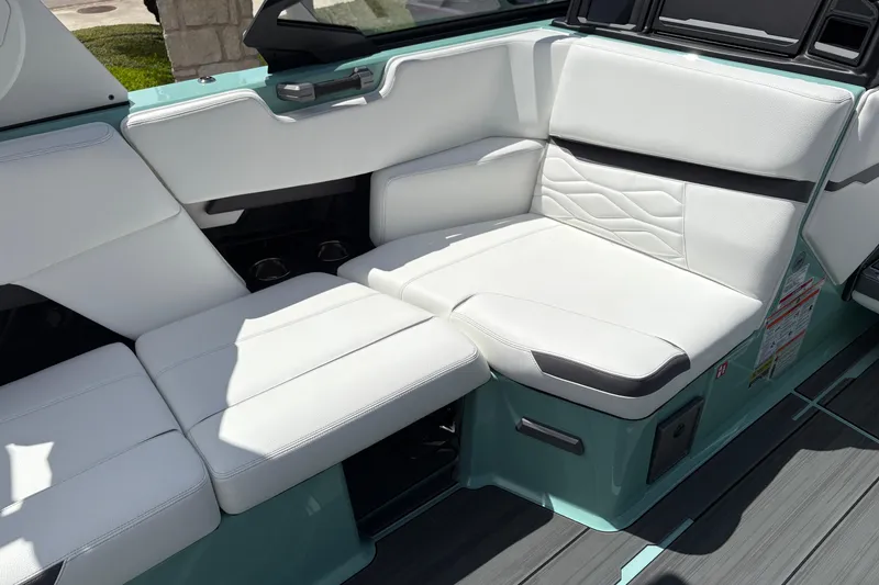 Slide: The Image of Luxurious white seating in the 2026 Supra SE 550 boat interior. - 26