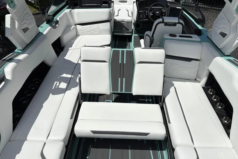 Slide: The Image of 2026 Supra SE 550 boat interior with luxurious white seating and modern design. - 29