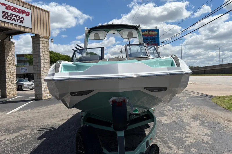 Slide: The Image of 2026 Supra SE 550 boat displayed outdoors under a clear blue sky. - 3