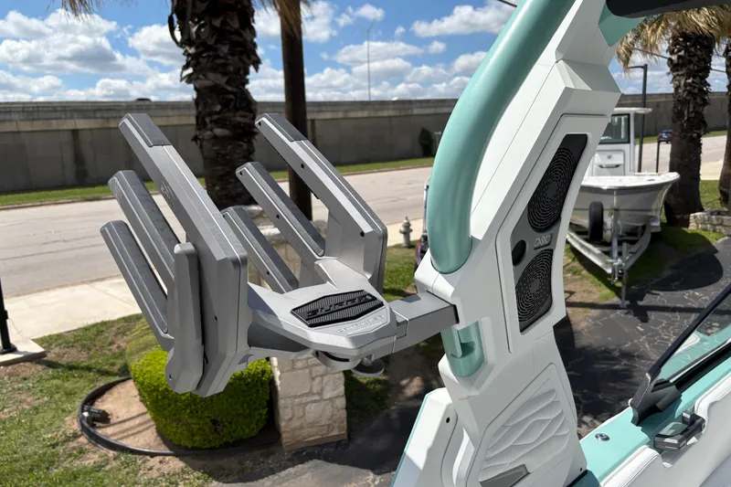 Slide: The Image of 2026 Supra SE 550 boat tower with wakeboard rack and speakers, under a sunny sky. - 30