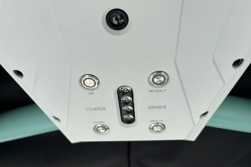 Slide: The Image of Control panel of 2026 Supra SE 550 boat with tower and bimini buttons. - 34