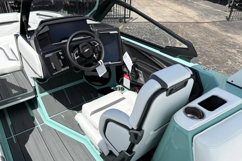 Slide: The Image of Interior of 2026 Supra SE 550 boat with modern dashboard and steering wheel. - 36