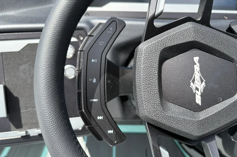 Slide: The Image of Steering wheel of 2026 Supra SE 550 with integrated controls and logo. - 39