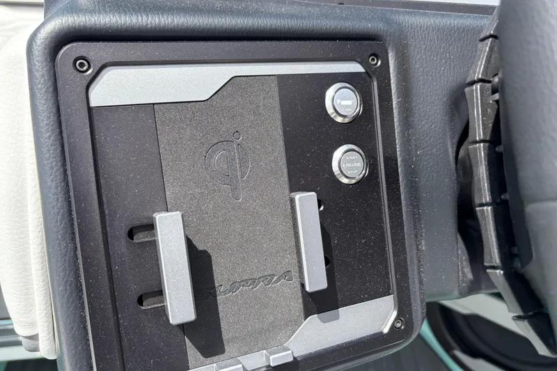 Slide: The Image of Control panel of 2026 Supra SE 550 with start button and Qi wireless charging. - 41