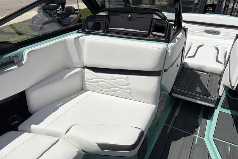 Slide: The Image of 2026 Supra SE 550 boat interior with white leather seating and modern design. - 42