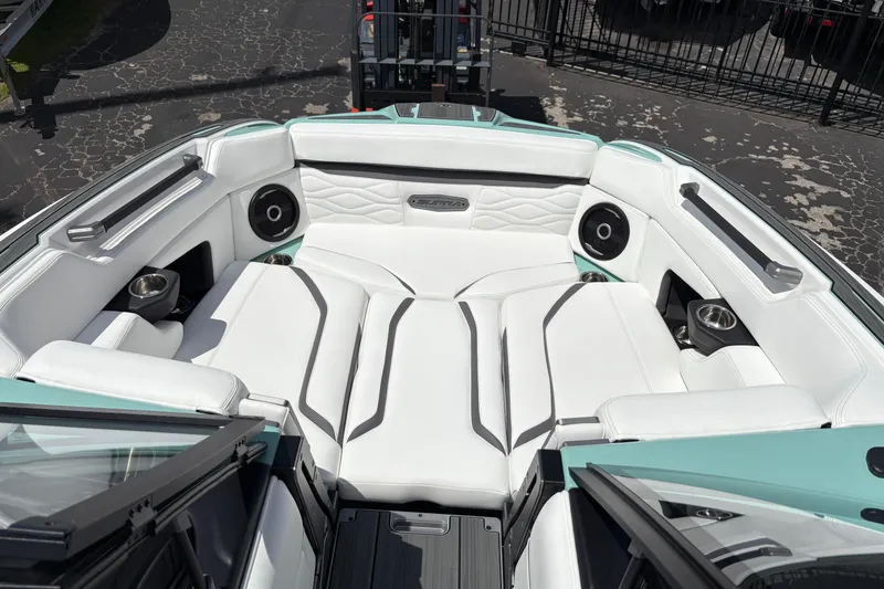 Slide: The Image of Luxurious interior of 2026 Supra SE 550 boat with white seating and speakers. - 44