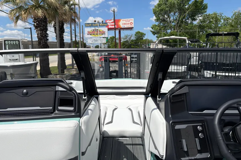Slide: The Image of Interior view of 2026 Supra SE 550 boat with modern dashboard and seating. - 45