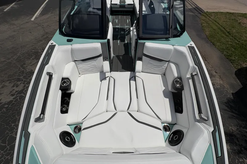 Slide: The Image of 2026 Supra SE 550 boat interior with white seating and integrated speakers. - 46