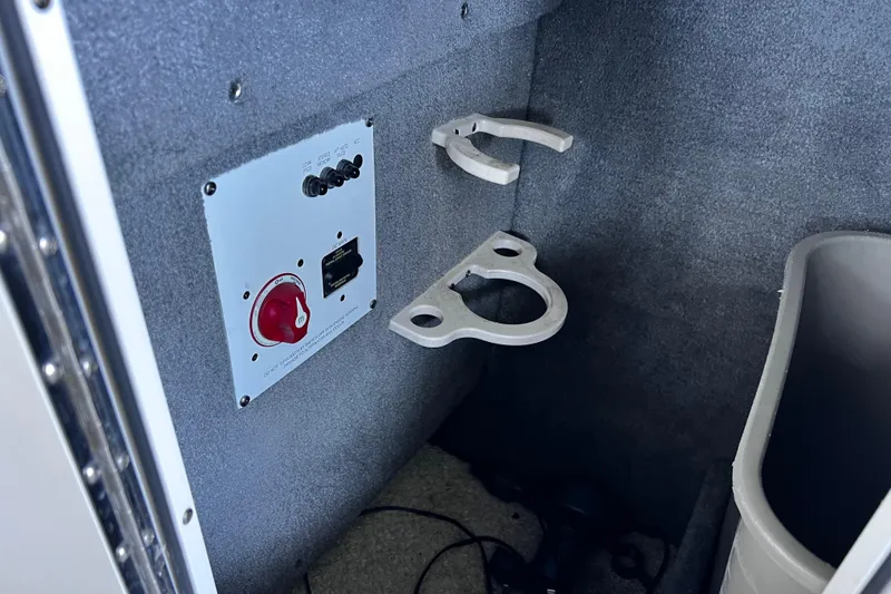 Slide: The Image of 2010 Chaparral Sunesta 224 interior with control panel and cup holders. - 17