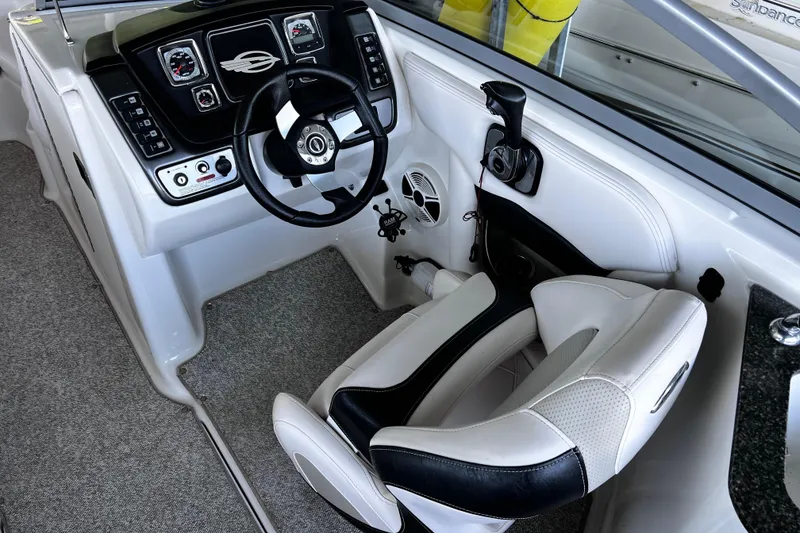 Slide: The Image of 2010 Chaparral Sunesta 224 boat cockpit with steering wheel and control panel. - 6