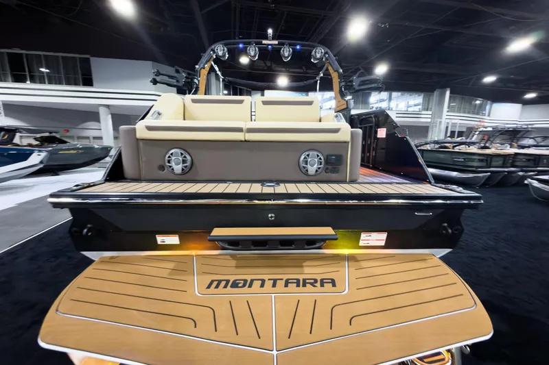 Slide: The Image of 2026 Montara Surf Boss EVO SLDH 25' boat, rear view with seating and speakers. - 14