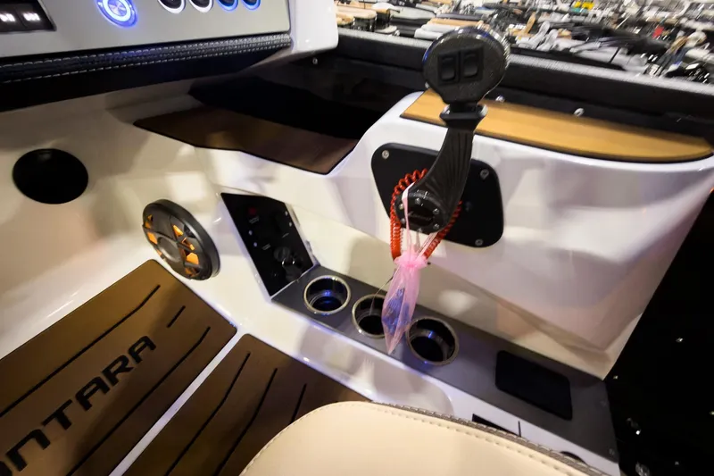 Slide: The Image of Interior of 2026 Montara Surf Boss EVO boat with controls and speaker. - 23