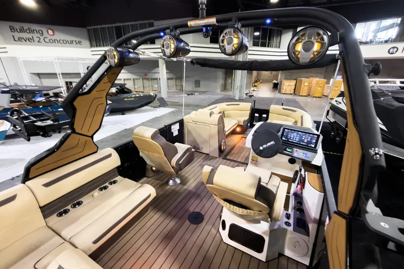 Slide: The Image of 2026 Montara Surf Boss EVO 25' boat interior with luxurious seating and advanced controls. - 25
