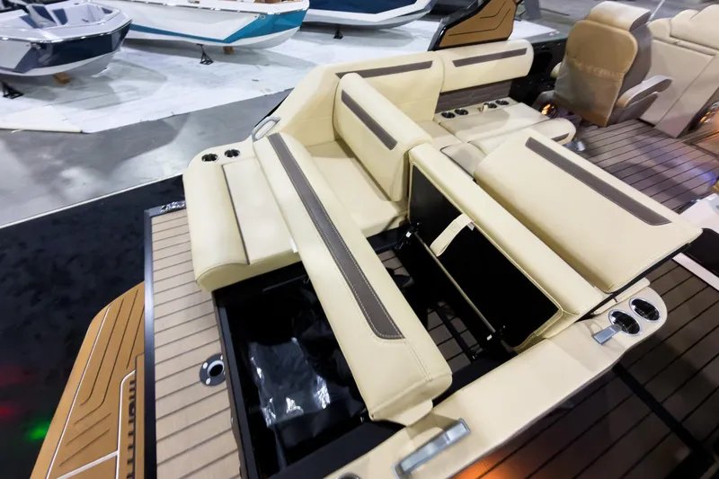 Slide: The Image of Luxurious seating on 2026 Montara Surf Boss EVO SLDH 25' boat, featuring beige upholstery. - 29