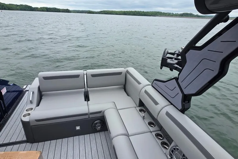 Slide: The Image of Luxurious seating on 2026 Montara Surf Boss EVO SLDH 25' boat, overlooking serene waters. - 3