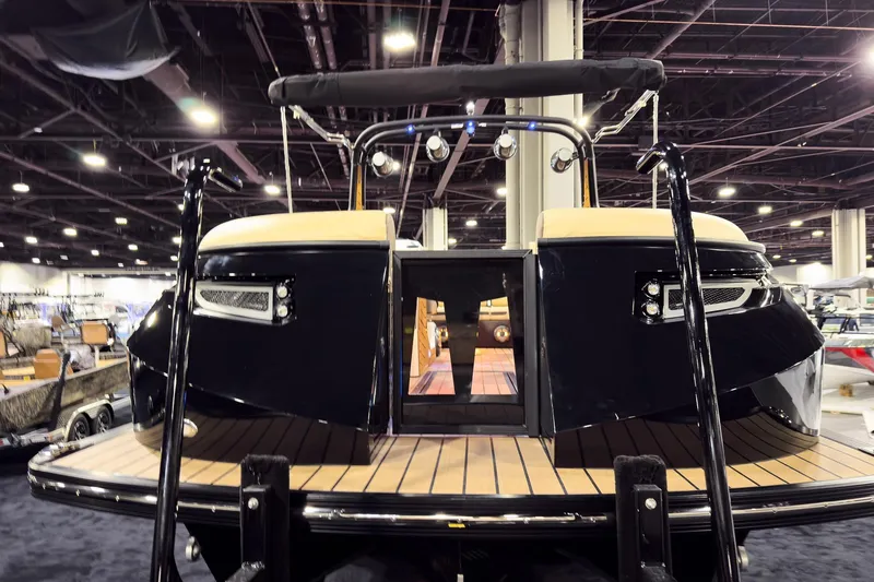 Slide: The Image of 2026 Montara Surf Boss EVO SLDH 25' boat displayed at an indoor exhibition. - 9