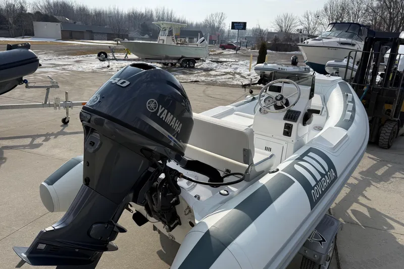Slide: The Image of 2026 Novurania DL 360 boat with Yamaha outboard motor, displayed outdoors on a sunny day. - 3