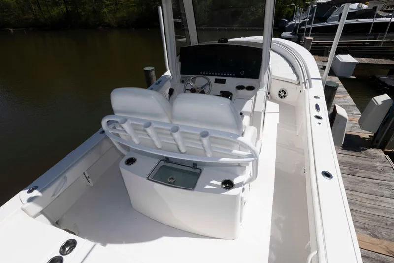 Slide: The Image of 2021 Regulator 26XO boat interior with dual seats and control panel. - 22