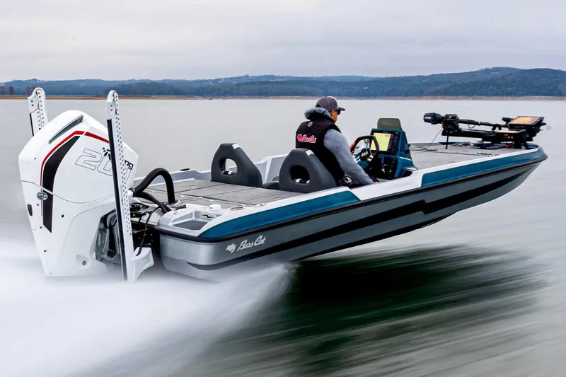 The Image of 2027 Bass Cat Pantera boat speeding on a lake with a person at the helm. - 0